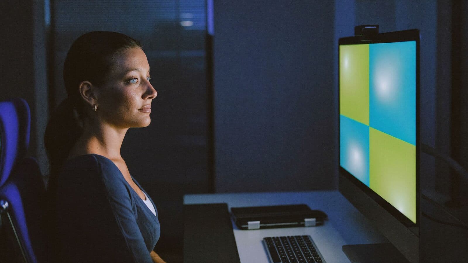 Founder reviewing a business dashboard on a large screen in the evening